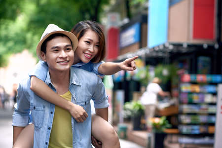 Young couple having fun in city streetの写真素材
