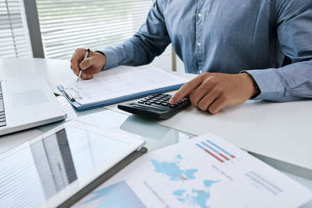 Working with financial documentsの写真素材