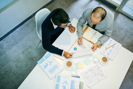 Business people working with documents, view from aboveの写真素材