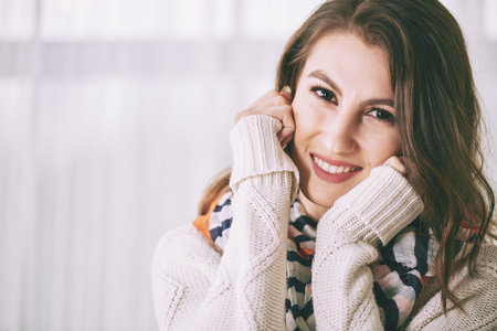 POrtrait of pretty brunette in warm winter sweater