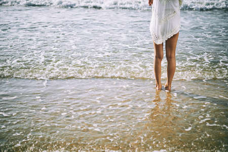 Enjoying sea wavesの写真素材