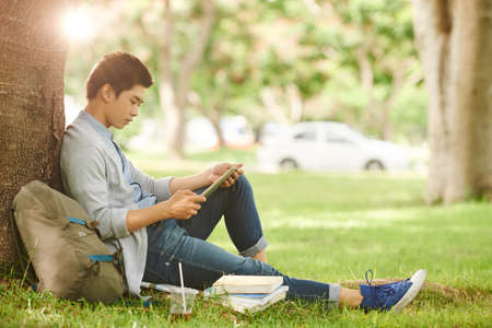 Working on Project in Public Parkの写真素材