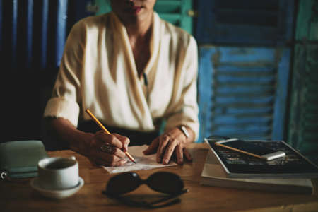 Close-up image of business lady drawing ideas on a napkin, selective focusの写真素材