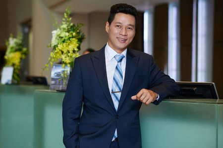 Asian Hotel Owner Posing for Photographyの写真素材