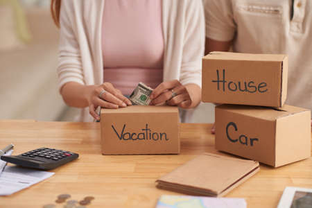 Young Family Saving Moneyの写真素材