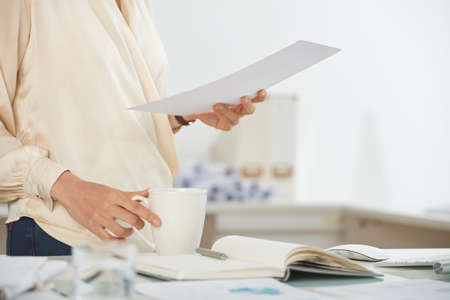 Elegant businesswoman with documentの写真素材