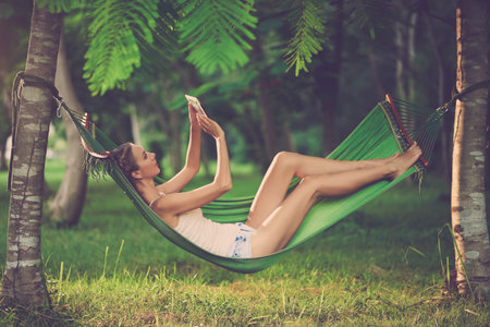 Taking Selfie in Tropical Gardenの写真素材