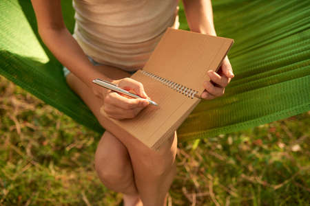 Unrecognizable Woman Working Outdoorsの写真素材