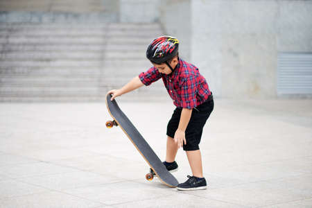 Learning skateboardingの写真素材