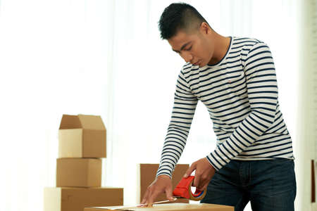 Vietnamese Man Packing Stuffの写真素材