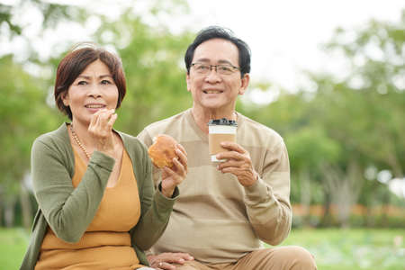 Enjoying coffee in parkの写真素材