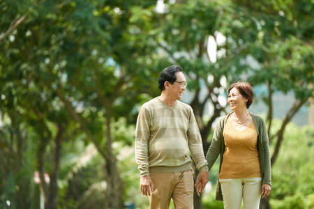 Cheerful couple in parkの写真素材