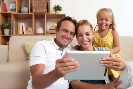 Watching funny videosの写真素材