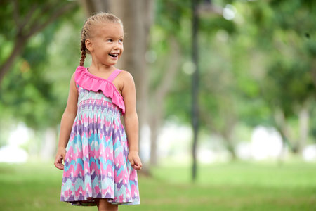 Girl in summer parkの写真素材