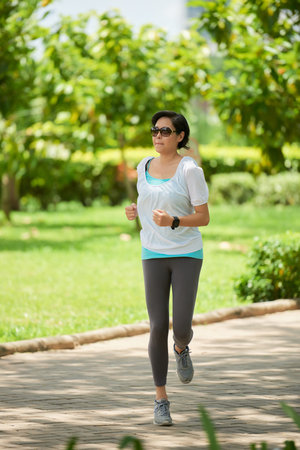 Asian Woman Running Outdoors