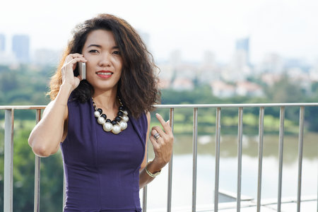 Young lady having phone conversation
