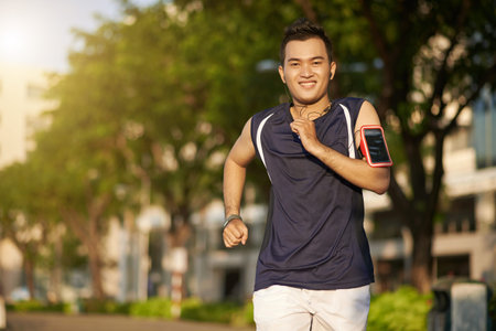 Young man jogging at parkの写真素材