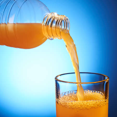 Pouring orange juiceの写真素材