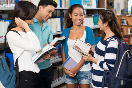 College students discussing homeworkの写真素材