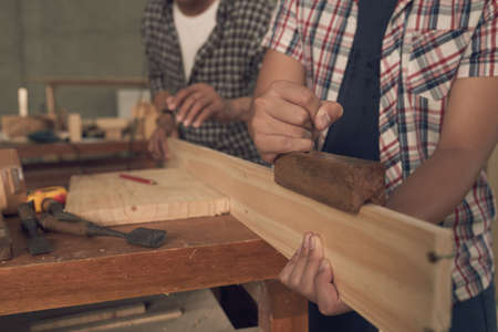 Working with wooden plankの写真素材