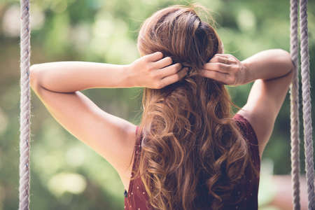Adjusting hairの写真素材