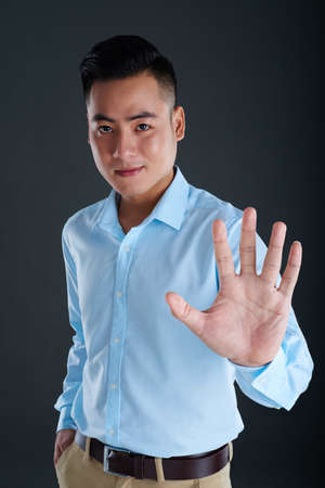 Touching screen with palmの写真素材