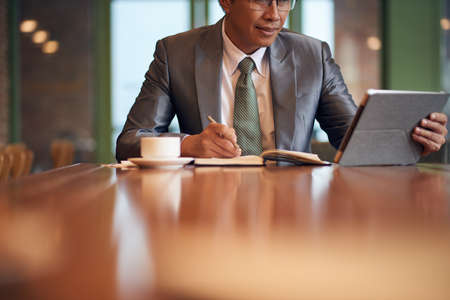 Businessman taking notesの写真素材