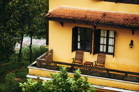 Balcony of countryside villa house with balcony wet after rainの写真素材