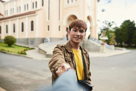 Young asian guy taking selfieの写真素材