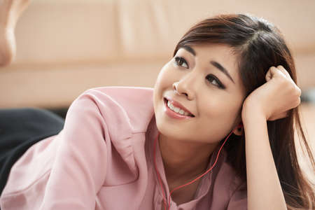 Pretty girl resting on bedの写真素材