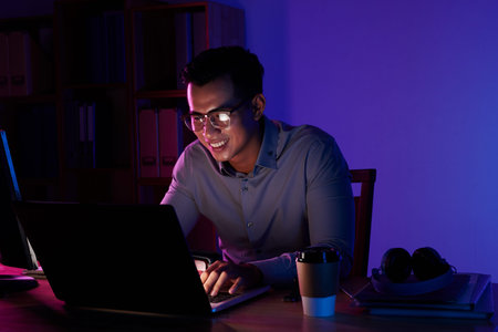 Young man working all night long