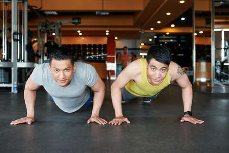 Two athletes doing push-upsの写真素材
