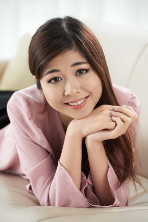 Pretty lady resting at homeの写真素材