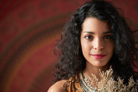 Face of young Latin woman smiling at camera