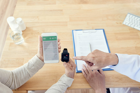 Female senior patient showing mobile application with health activities and heart rate