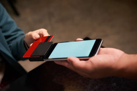 Woman paying with credit card for the orderの写真素材