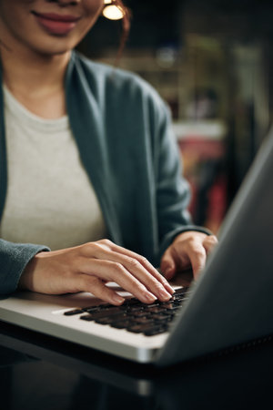 Hands of business lady working on laptopの写真素材