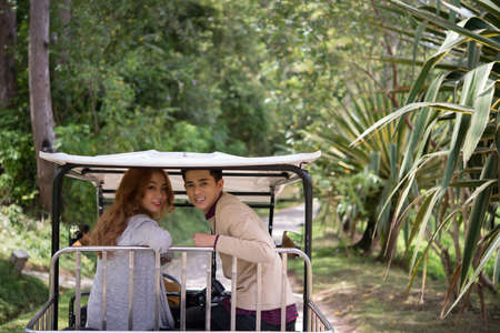 Vietnamese young couple exploring park in rickshawの写真素材