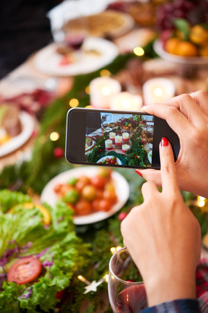 Photographing Christmas tableの写真素材