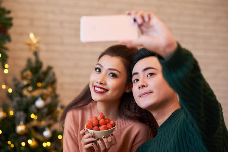 Couple taking selfieの写真素材