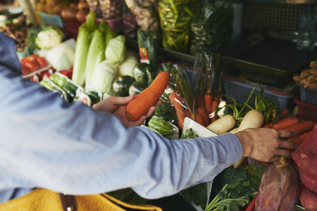 Woman Buying fresh carrotの写真素材
