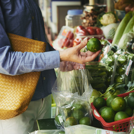 Buying fresh limesの写真素材