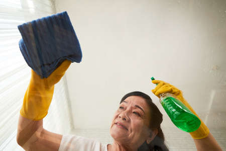 Woman Wiping off every spotの写真素材