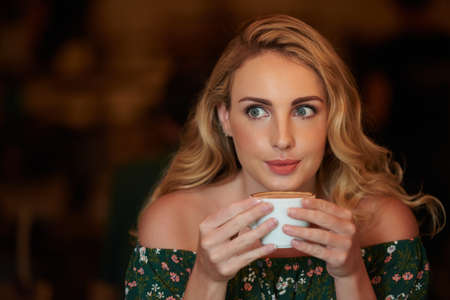 Enjoying cappuccinoの写真素材