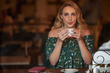 Enjoying tasty coffeeの写真素材