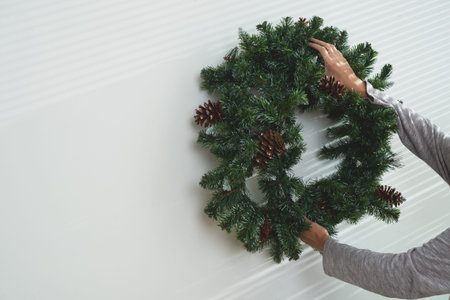 Handing Christmas decoration