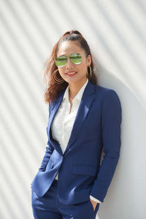 Portrait of smiling female entrepreneur in sunglassesの写真素材