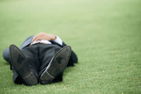 Lying on grassの写真素材