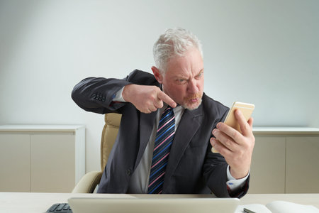 Senior Businessman Expressing Negative Emotions