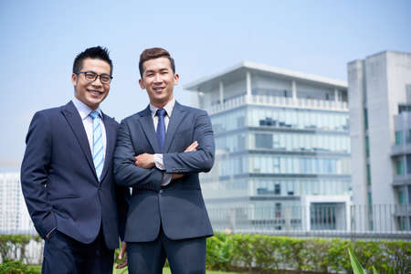 Portrait of confident young business people smiling and looking at cameraの写真素材